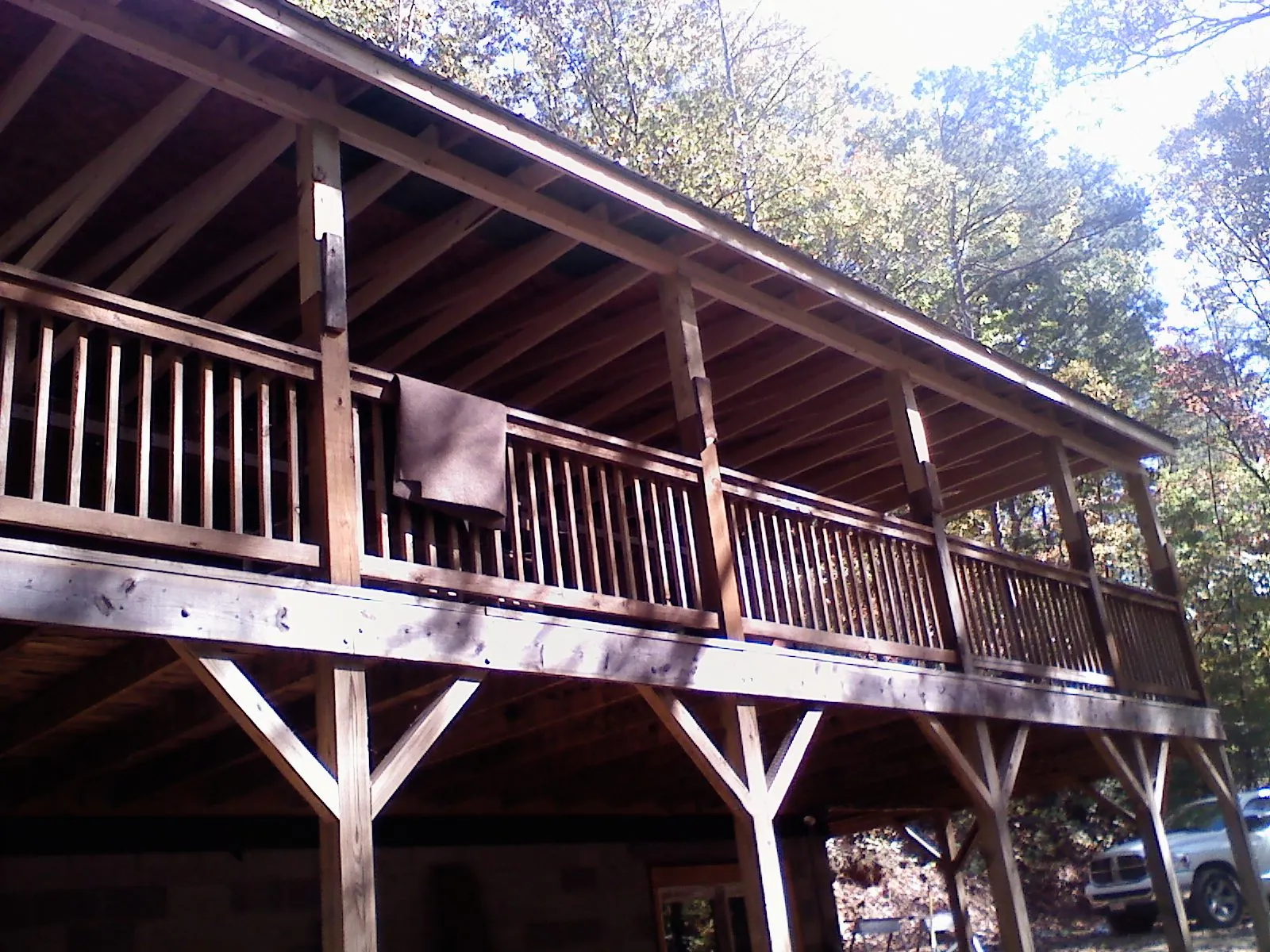 Timber framing under a new elevated porch and deck — Roof Leak Repair in Owosso by Roofing Brothers